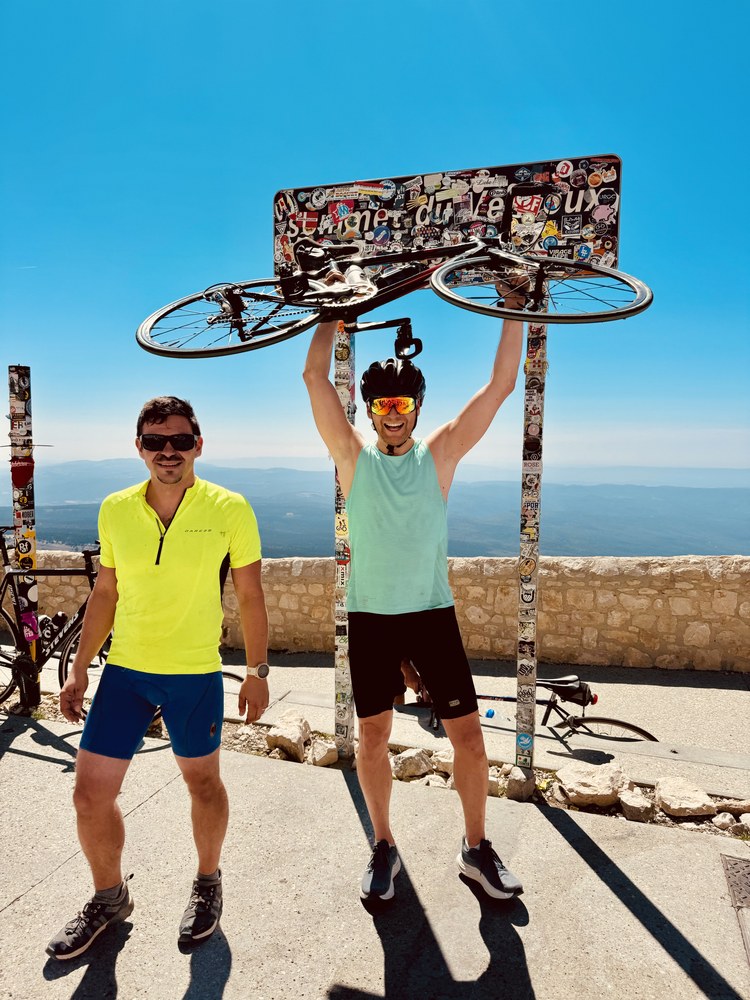 Sven holding his bike up under the summit sign of Mont Ventoux